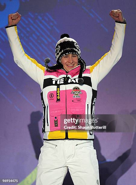 Kerstin Szymkowiak of Germany receives the silver medal during the medal ceremony for the women's skeleton held at the Whistler Medals Plaza on day 9...