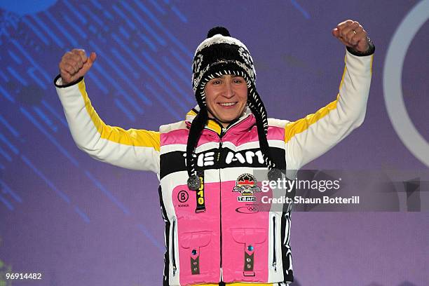 Kerstin Szymkowiak of Germany receives the silver medal during the medal ceremony for the women's skeleton held at the Whistler Medals Plaza on day 9...