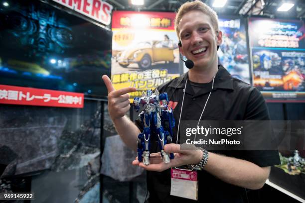 An exhibitor shows Transformer at the International Tokyo Toy Show in Japan on June 7, 2018.