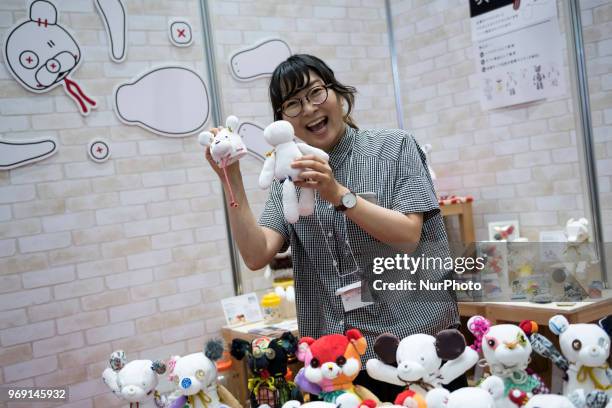 An exhibitor shows Kumiguma a puppet that can be assembled using 12 parts at the International Tokyo Toy Show in Japan on June 7, 2018.