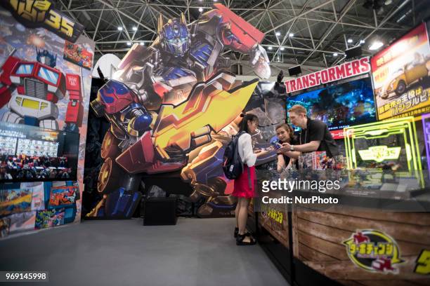 An exhibitor shows Transformer at the International Tokyo Toy Show in Japan on June 7, 2018.