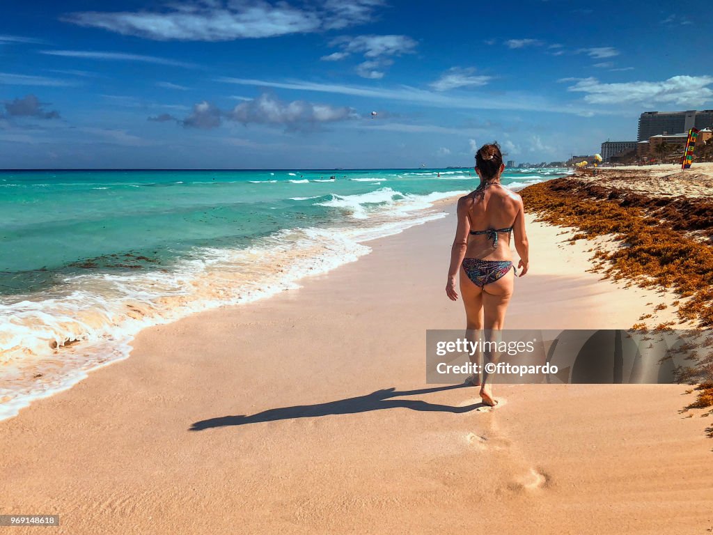 Woman walking on a beach