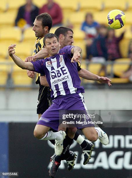 Andrew Durante captain and Manny Muscat of the Phoenix jump for the ball with Mile Sterjovski of the Glory during the A-league Semi Final match...