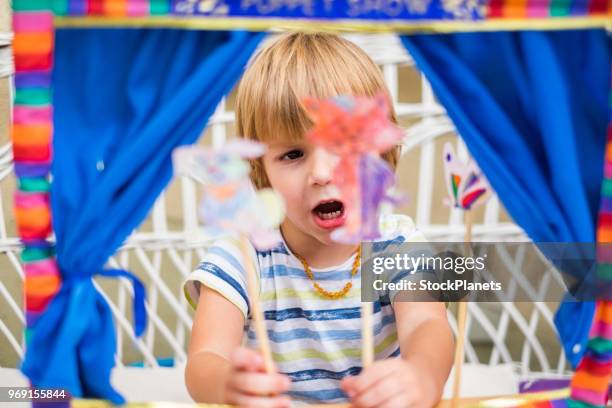 cute little boy playing with puppet - puppet theatre stock pictures, royalty-free photos & images