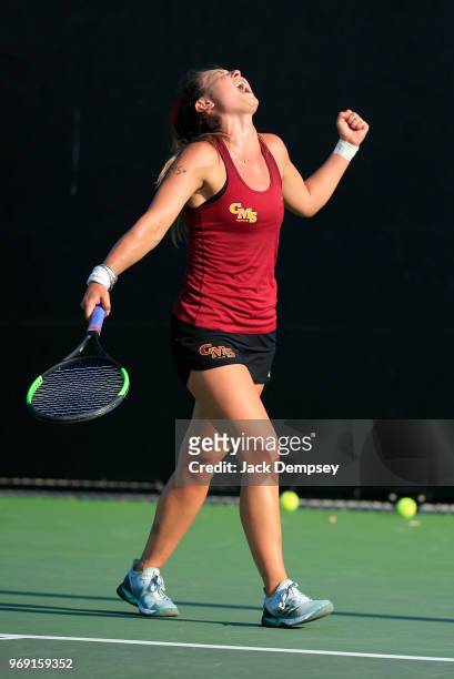 Catherine Allen of the Claremont-Mudd-Scripps Athenas reacts after winning a point against Bridget Harding of the Emory Eagles during the Division...