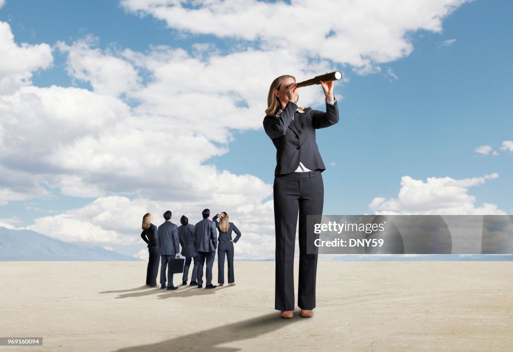 One Businesswoman Stands Out From A Group And Searches For A Solution