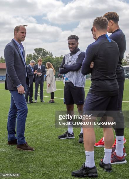 Britain's Prince William, Duke of Cambridge , President of the Football Association speaks with England football players, England's defender Danny...