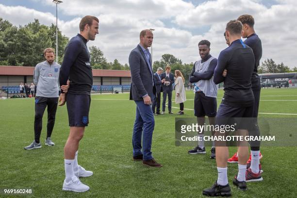 Britain's Prince William, Duke of Cambridge , President of the Football Association speaks with England football players, England's striker Harry...