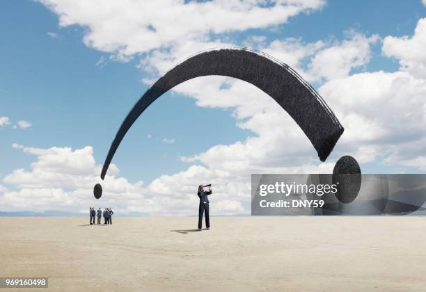 one businesswoman stands out from a group and searches for a solution - moral compass stock pictures, royalty-free photos & images