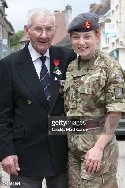 Ivor Stephens who was in a mine sweeper clearing the beaches on D-Day, poses for a photograph with Cpl Melissa Wilkinson from the Queen Alexandra's...