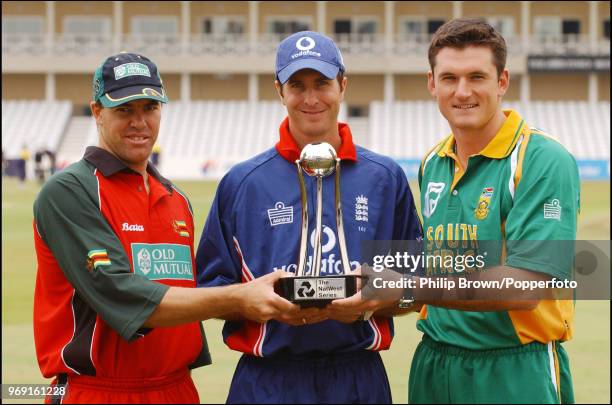 Team captains Heath Streak of Zimbabwe, Michael Vaughan of England and Graeme Smith of South Africa stand with the trophy at the launch of the...