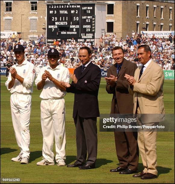 Past and present England cricketers Michael Vaughan, Mark Butcher, Nasser Hussain, Mike Atherton and Graham Gooch applaud teammate Alec Stewart...