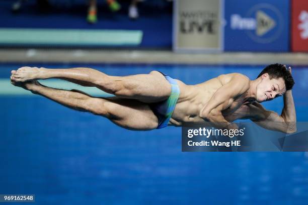 Patrick Hausding of Germany compete in the men's 3m Synchro Springboard final on FINA Diving World Cup 2018 at the Wuhan Sports Center on June 7,...