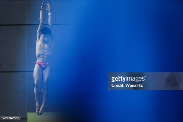 Cao Yuan of China compete in the men's 3m Synchro Springboard final on FINA Diving World Cup 2018 at the Wuhan Sports Center on June 7, 2018 in...