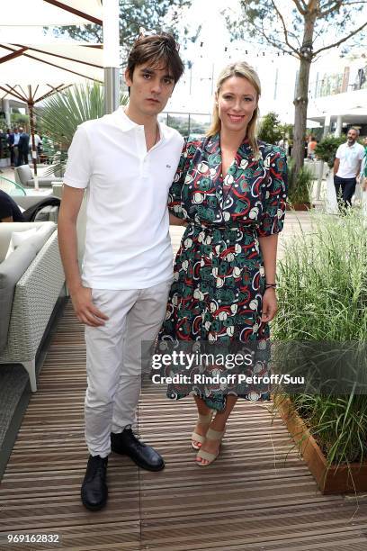 Actress Kiera Chaplin and Alain Fabien Delon attend the 2018 French Open - Day Twelve at Roland Garros on June 7, 2018 in Paris, France.