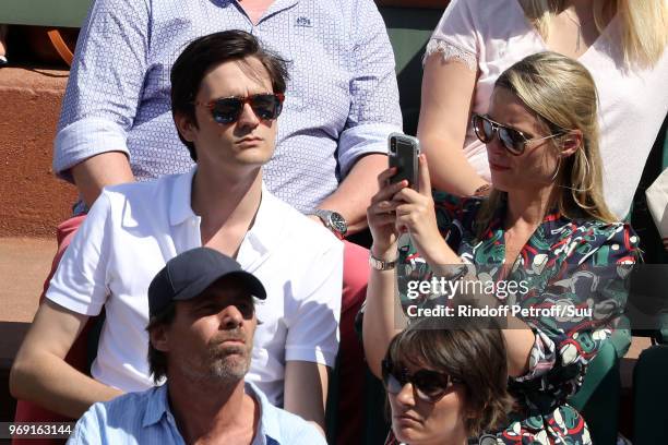 Alain-Fabien Delon and Kiera Chaplin attend the 2018 French Open - Day Twelve at Roland Garros on June 7, 2018 in Paris, France.
