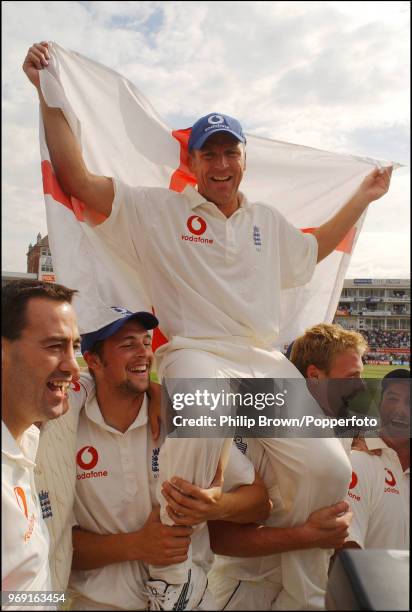 Alec Stewart of England is paraded around the ground by teammates after England won the 5th Test match between England and South Africa by 9 wickets...