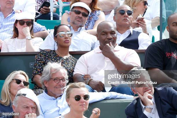 Mike Tyson and his wife Kiki Tyson attend the 2018 French Open - Day Twelve at Roland Garros on June 7, 2018 in Paris, France.