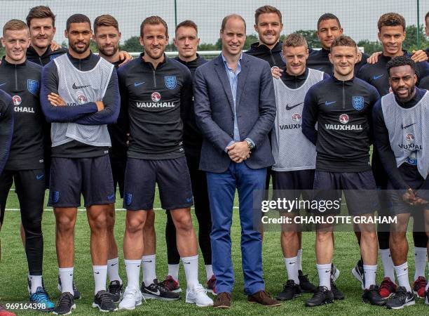 Britain's Prince William, Duke of Cambridge , President of the Football Association poses for a photograph with England football squad members...