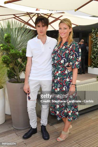 Actors Alain Fabien Delon and Kiera Chaplin attend the 2018 French Open - Day Twelve at Roland Garros on June 7, 2018 in Paris, France.