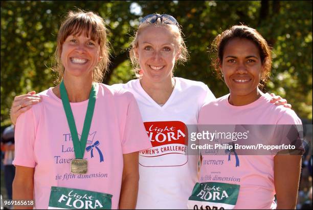 Journalist Sue Mott with runners Paula Radcliffe and Cathy Freeman after the Flora Light Women's Challenge at Hyde Park, London, 14th September 2003.