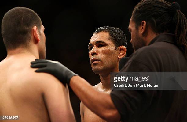 Fighter Cain Velasquez faces off with UFC fighter Minotauro Nogueira before their Ultimate Fighting Championship world heavyweight fight at Acer...
