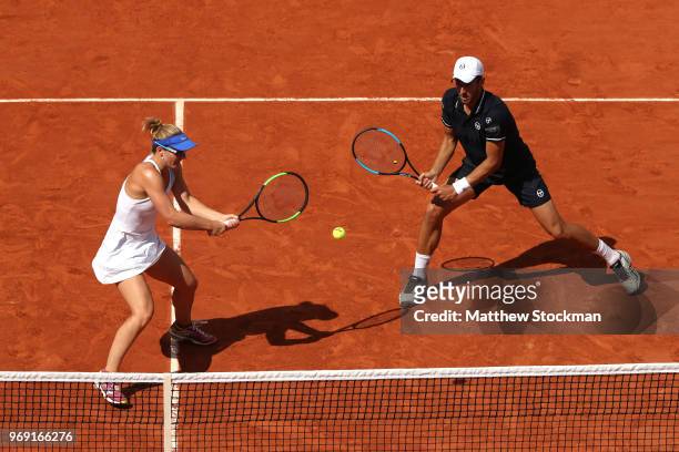 Gabriela Dabrowski of Canada and partner Mate Pavic of Croatia return the ball during the mixed doubles Final against Latisha Chan of Chinese Taipei...