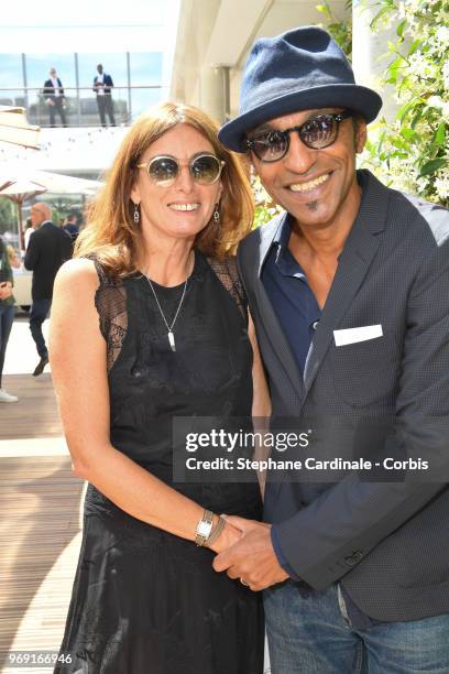Musician Manu Katche and his wife Laurence attend the 2018 French Open - Day Twelve at Roland Garros on June 7, 2018 in Paris, France.