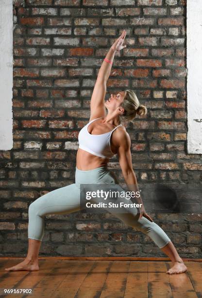 Yoga teacher and Wales and Ospreys Rugby Union player Alecs Donovan pictured demonstrating a Peaceful Warrior/ Shanti Virabhadrasana during a Yoga...