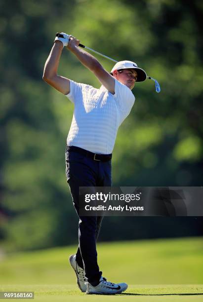 Cody Gribble of the United States hits his second shot on the 16th hole during the first round of the FedEx St. Jude Classic at TPC Southwind on June...