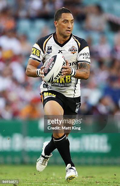 Benji Marshall of the Tigers runs with the ball during the Foundation Cup NRL trial match between the Sydney Roosters and the Wests Tigers at the...