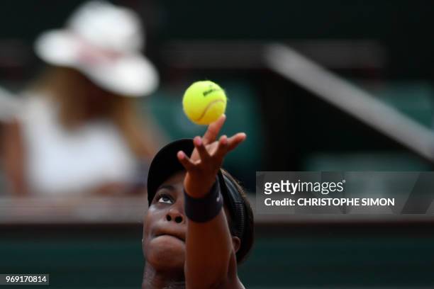 Sloane Stephens of the US eyes the ball as she serves the ball to Madison Keys the US during their women's singles semi-final match on day twelve of...