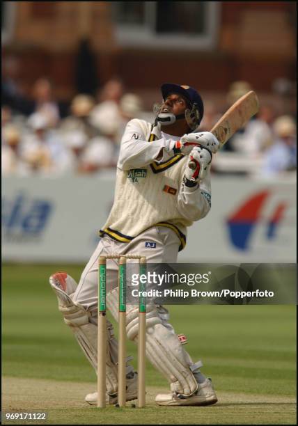 Aravinda de Silva of Sri Lanka watches the ball after a pull shot during the 1st Test match between England and Sri Lanka at Lord's Cricket Ground,...