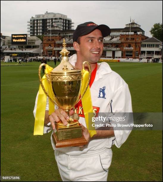 Warwickshire captain Michael Powell carries the Benson and Hedges Cup on a lap of honour after Warwickshire won the Benson and Hedges Cup Final...