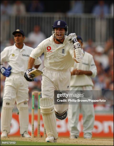 Michael Vaughan of England celebrates reaching his century during his innings of 195 in the 4th Test match between England and India at The Oval,...