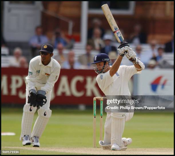 Michael Vaughan of England drives a delivery during his innings of 115 in the 1st Test match between England and Sri Lanka at Lord's Cricket Ground,...