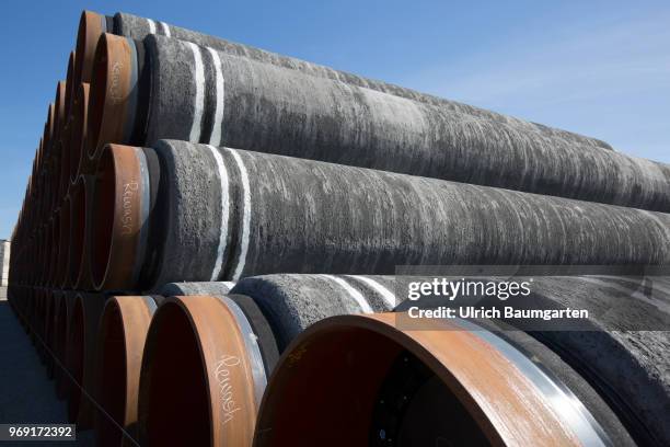 Large pipes for the Baltic Sea pipeline Nord Stream 2 on a storage area in the ferry port of Sassnitz/Neu Mukran. The pipes are sheathed with a...