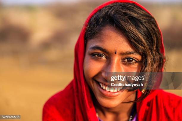 portrait of happy indian girl in desert village, india - gypsy stock pictures, royalty-free photos & images