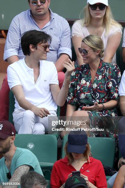 Alain-Fabien Delon and actress Kiera Chaplin attend the 2018 French Open - Day Twelve at Roland Garros on June 7, 2018 in Paris, France.