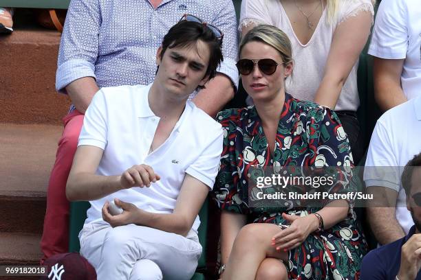 Alain-Fabien Delon and actress Kiera Chaplin attend the 2018 French Open - Day Twelve at Roland Garros on June 7, 2018 in Paris, France.