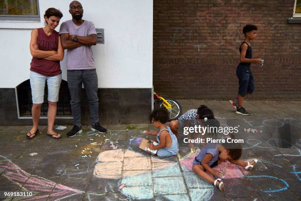 Children draw hearts on the pavement outside the Laleli Mosque on June 7, 2018 in Rotterdam, Netherlands.The anti-Islam group Pegida plans to roast...