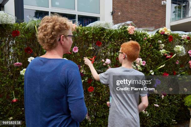 Child places flowers outside the Laleli Mosque on June 7, 2018 in Rotterdam, Netherlands.The anti-Islam group Pegida plans to roast pigs on a...