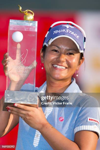 Ai Miyazato of Japan poses with the trophy after winning the final round of the Honda PTT LPGA Thailand at Siam Country Club on February 21, 2010 in...