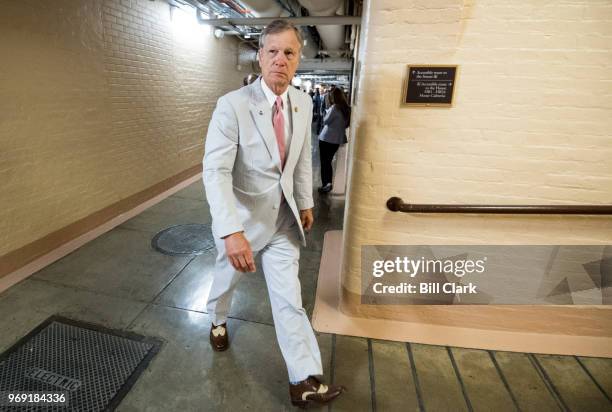 Rep. Brian Babin, R-Texas sports his seersucker suit as he leaves the House Republicans' caucus meeting in the Capitol on immigration reforms on...