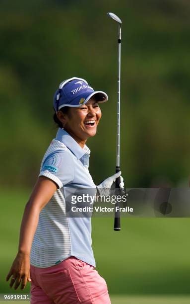 Ai Miyazato of Japan celebrates after sinking a chip shot on the 18th green during the final round of the Honda PTT LPGA Thailand at Siam Country...