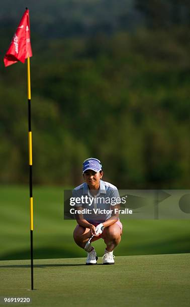 Ai Miyazato of Japan lines up a putt on the 18th green during the final round of the Honda PTT LPGA Thailand at Siam Country Club on February 21,...