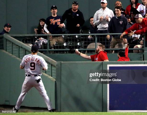 Detroit Tigers right fielder Nicholas Castellanos can only watch as a home run off the bat of Boston Red Sox left fielder Andrew Benintendi, not...