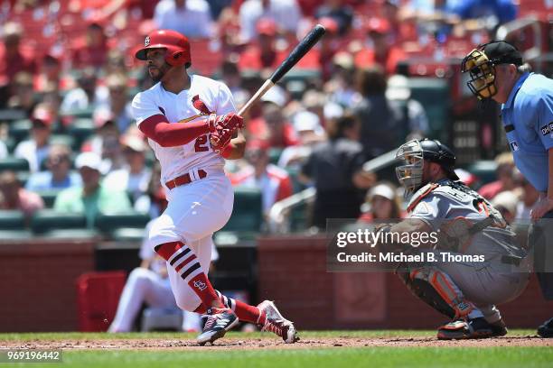 Tommy Pham of the St. Louis Cardinals hits a single in the first inning against the Miami Marlins at Busch Stadium on June 7, 2018 in St Louis,...