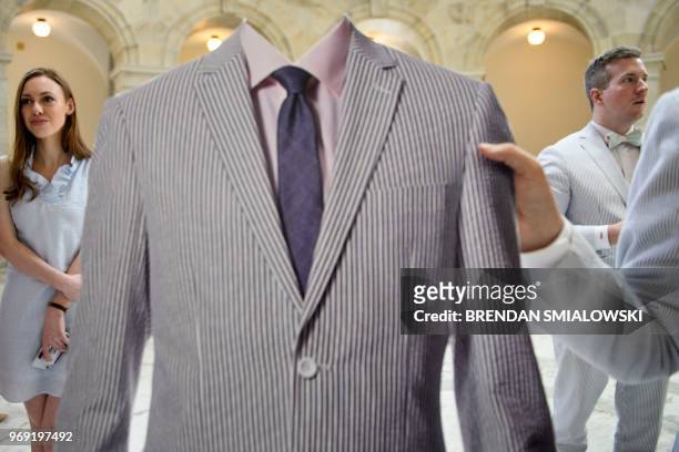 Staff dressed in seersucker clothing wait to be joined by Senators to celebrate national seersucker day on Capitol Hill June 7, 2018 in Washington,...