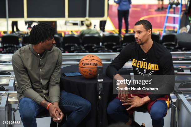 Rondae Hollis-Jefferson of the Brooklyn Nets interviews George Hill of the Cleveland Cavaliers during practice and media availability as part of the...